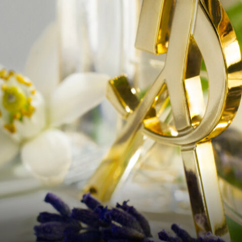 Gold YSL clasp surrounded by Orange Blossom and Lavender.