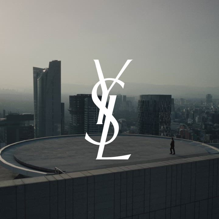 City skyline with whte YSL Cassandre logo