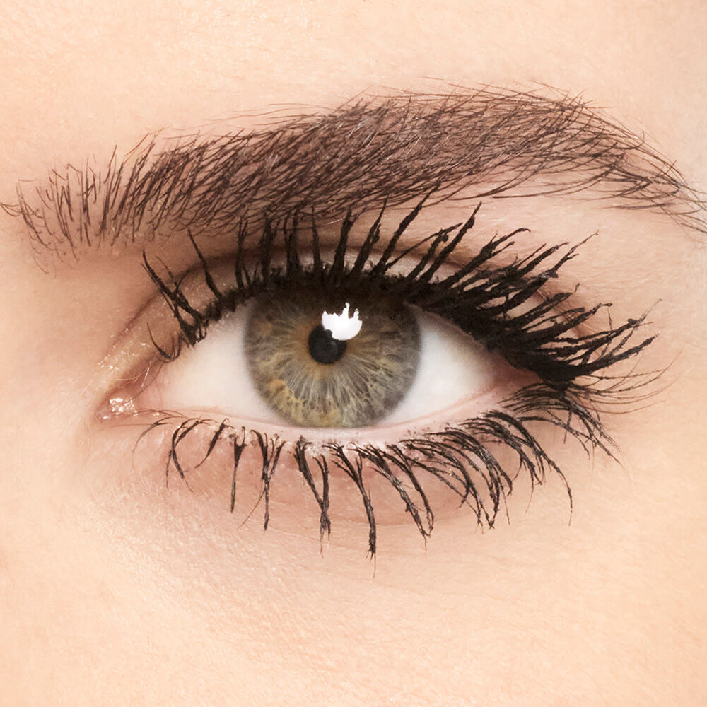 Close-up of an eye with mascara applied to the lashes.