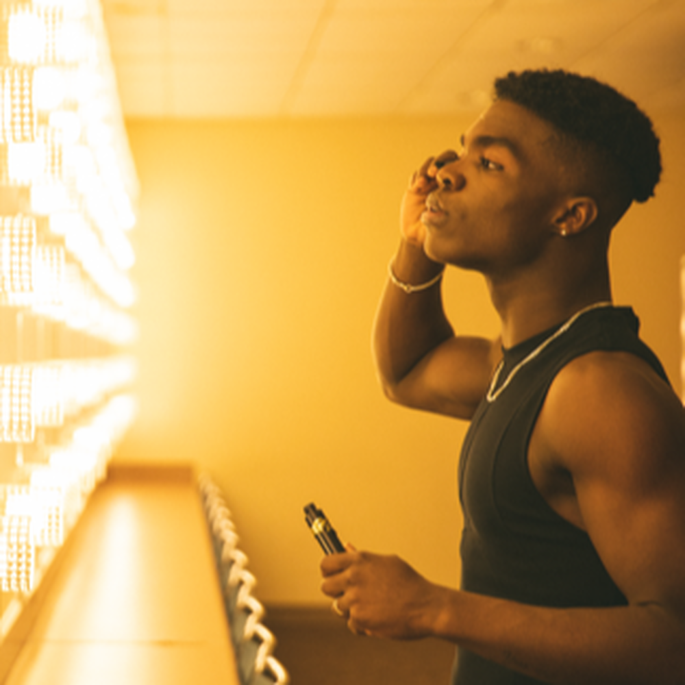 A person holding a YSL product with the text 'Jaxon Dancer.'