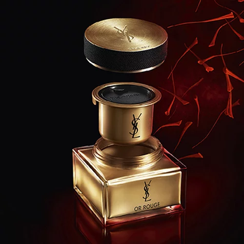 YSL Or Rouge cream jar with a gold lid and red background.