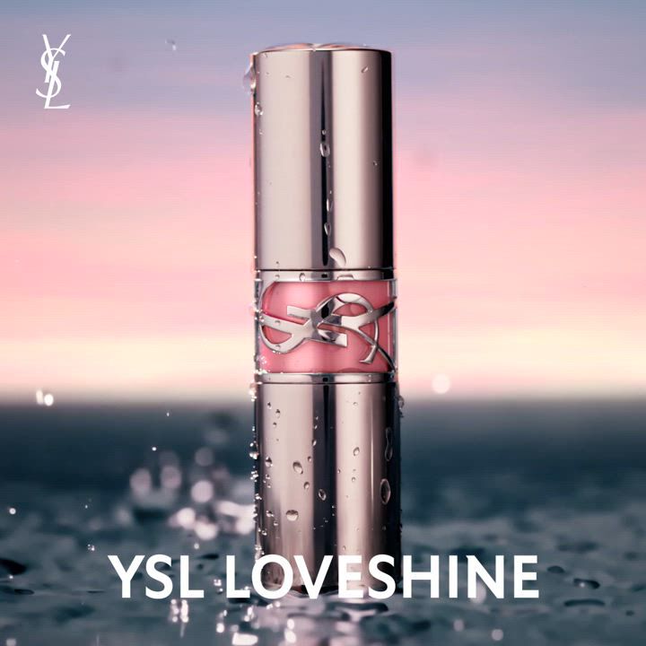YSL Loveshine lipstick standing in water with a sunset background.