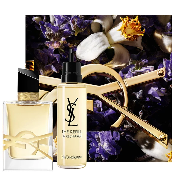 YSL perfume bottle and refill with floral background.