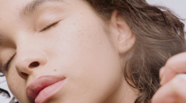 Close-up of hair being styled.