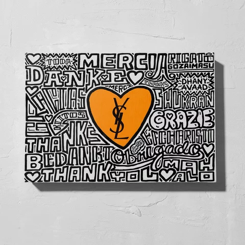 A canvas with a central orange heart featuring the YSL logo, surrounded by the word 'thank you' in various languages.