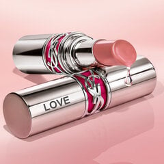 A silver tube of YSL lipstick with a droplet forming at the tip.