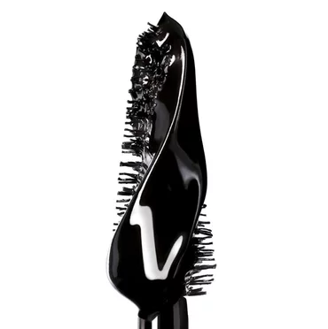 Close-up of a black mascara brush with mascara.