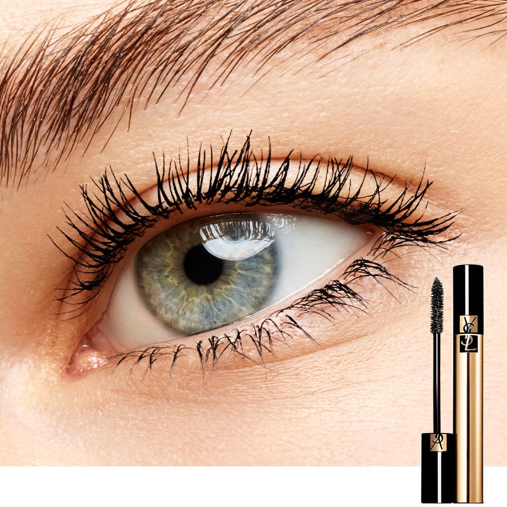 Close-up of an eye with long lashes, with a YSL mascara tube shown.