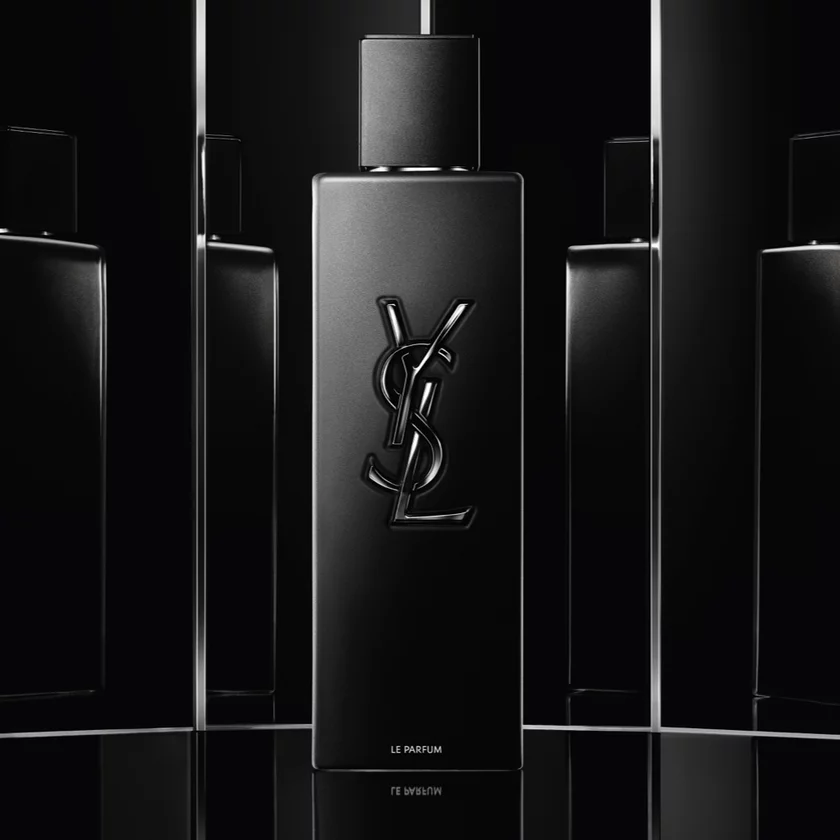 A black YSL perfume bottle with a reflective background.