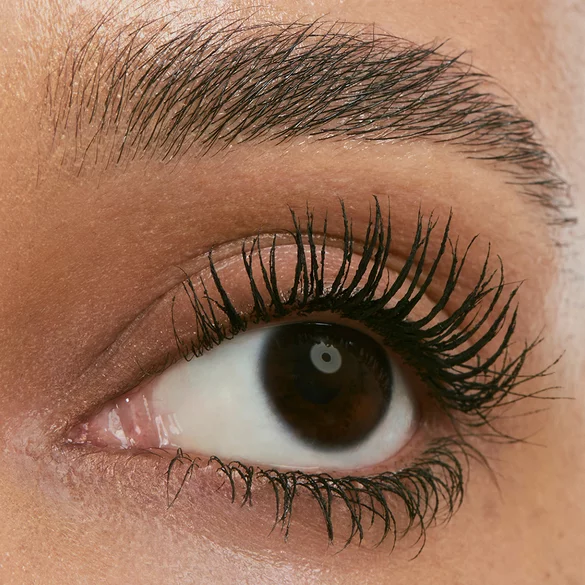 Close-up of an eye with long, defined eyelashes.