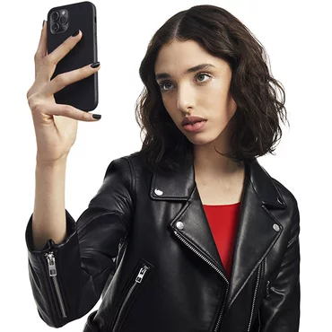 A person taking a selfie with a smartphone.
