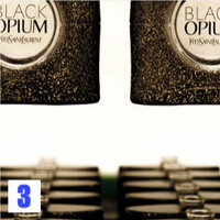 Several bottles of YSL Black Opium perfume with glittery black packaging.