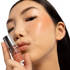 Model holding Loveshine Pumping Gloss