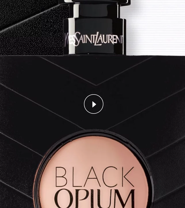 Close-up of YSL Black Opium perfume bottle with a play button icon.