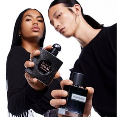 Two people holding YSL Black Opium and YSL Y perfumes.