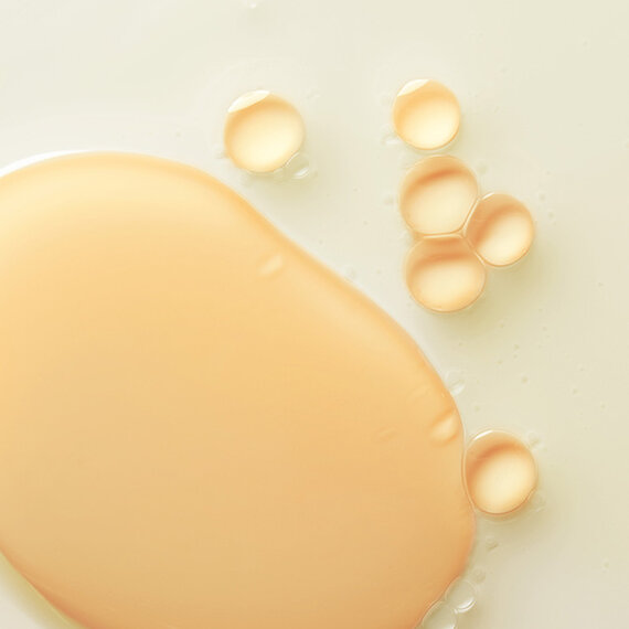 Close-up of liquid foundation and serum droplets.