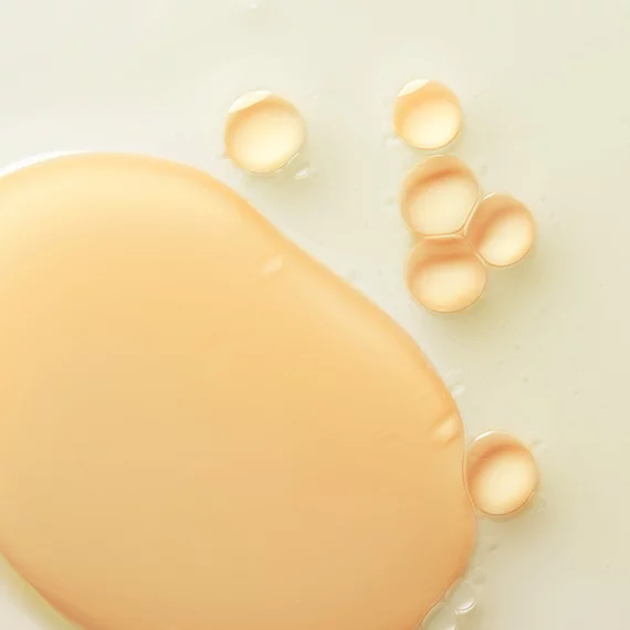 Close-up of liquid foundation and serum droplets.