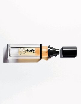 Rectangular YSL Pure Shots bottle with a black cap and amber liquid.