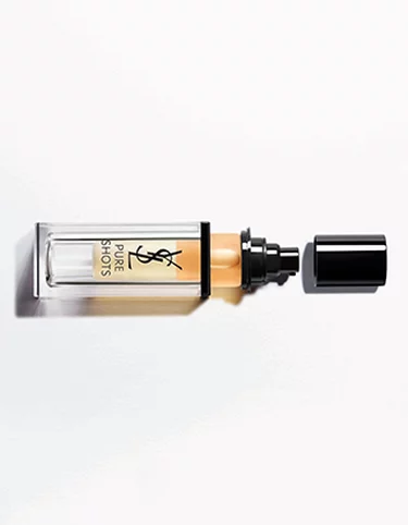 Rectangular YSL Pure Shots bottle with a black cap and amber liquid.