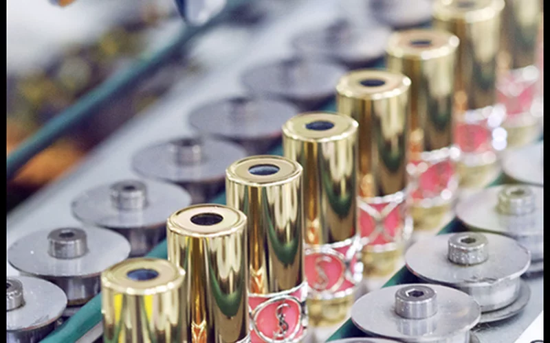 YSL lipsticks on a production line.