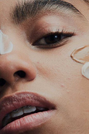 A person with a blurred face.