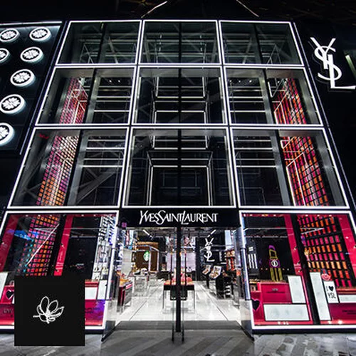 Yves Saint Laurent store with illuminated signage.