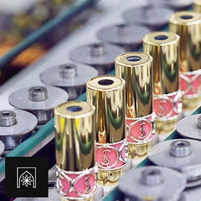 Several YSL lipsticks on a production line.