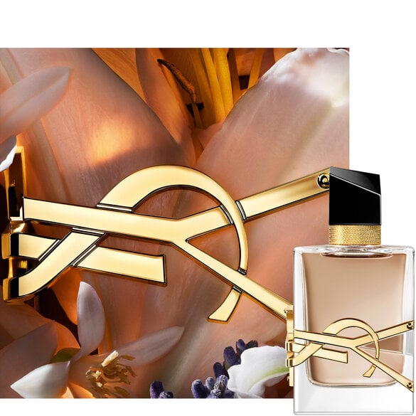 YSL Libre perfume bottle with a gold logo and floral background.
