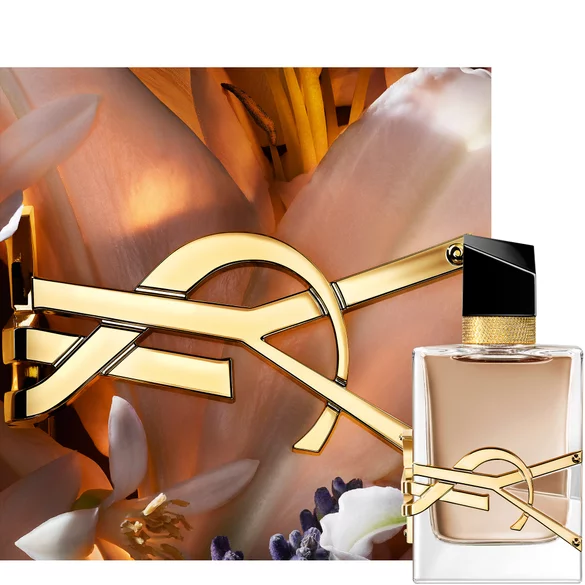 YSL Libre perfume bottle with a gold logo and floral background.