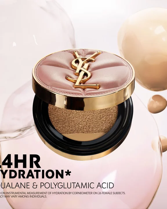 YSL SKIN AFFAIR CUSHION cases in a taxi cup holder with a glass of water. Luxury on-the-go hydration and soft glow.