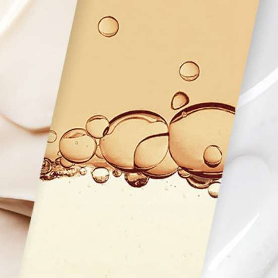 Close-up of bubbles in a golden liquid.