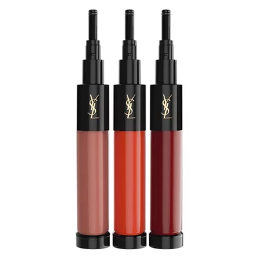 Three YSL lip gloss tubes in shades of nude, orange, and red.