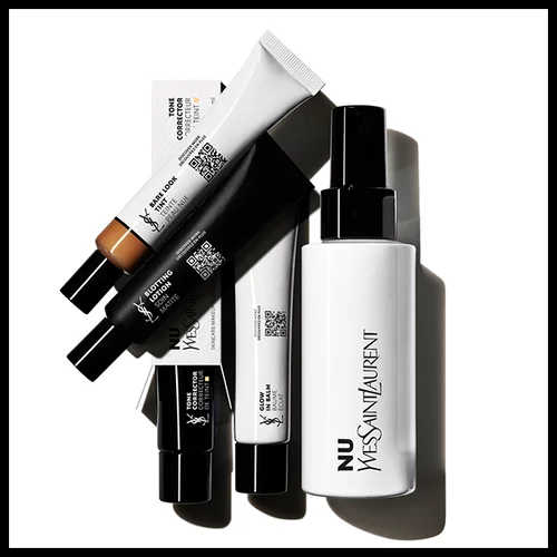 A collection of YSL Nu products including foundation, concealer, and tone corrector.