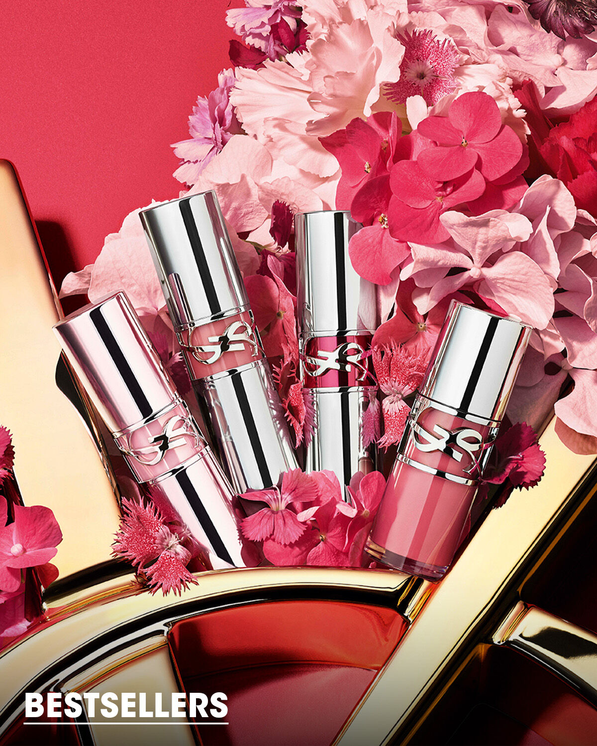 YSL lip products on flowers and red background