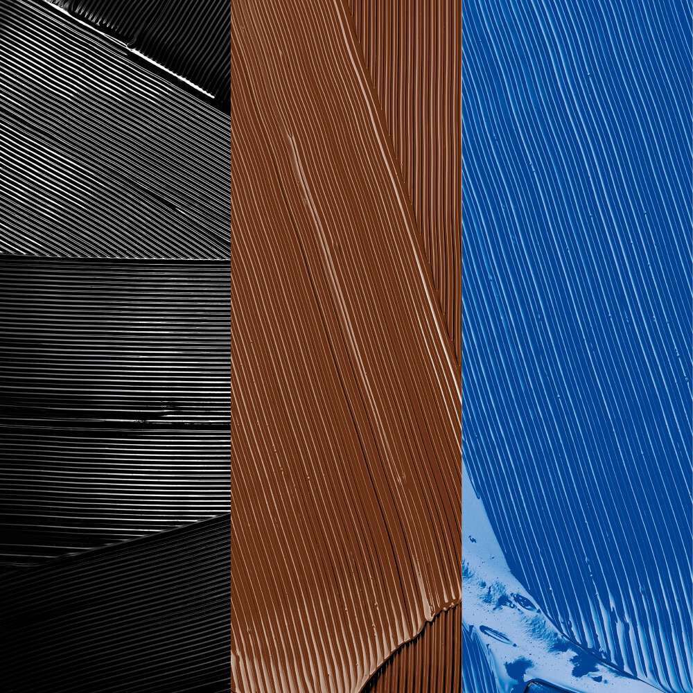 Swatches of black, brown, and blue mascara.