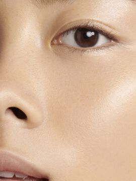 Close-up of a person's face with a natural makeup look.