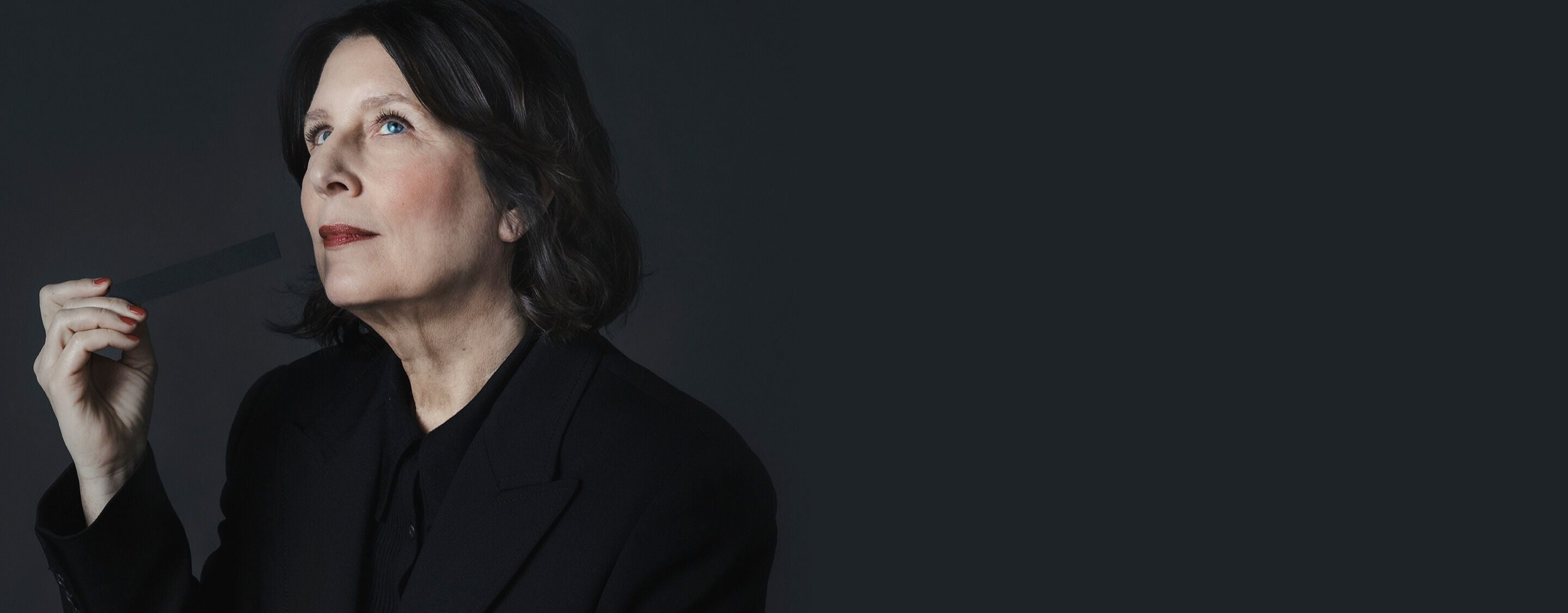 Master Perfumer Daniela Andrier
holding a scent strip, creator of the
radical YSL CŒUR signature.
